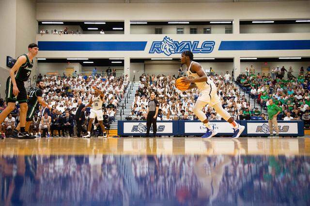 AJ McKee initiates the offense against Marshall in Queens’ first home men’s basketball game as a Division I program on Nov. 7, 2022, in the Levine Center.